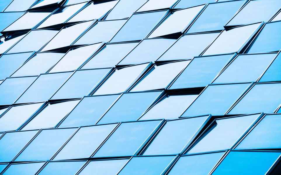 Glass tiles pattern in a modern building wall exterior.